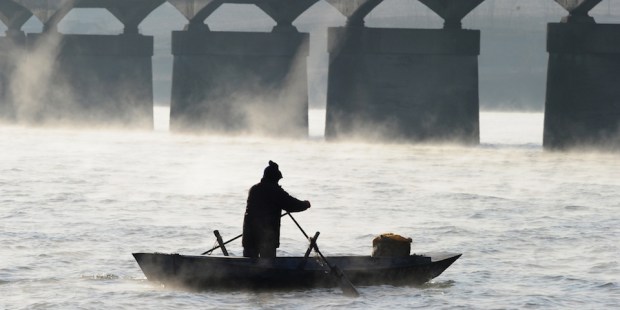 Steam rises off the freezing water as a